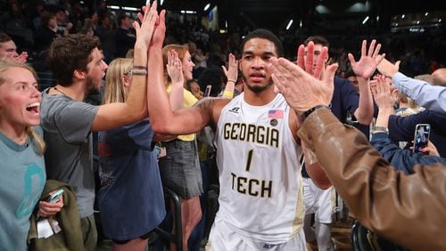 November 28, 2017 Atlanta: Georgia Tech guard Tadric Jackson high fives fans after his game winning shot at the horn for a 52-51 victory over Northwestern in a NCAA college basketball game on Tuesday, November 28, 2017, in Atlanta.   Curtis Compton/ccompton@ajc.com