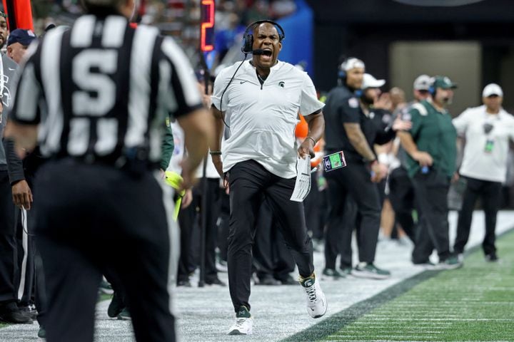 Michigan State Spartans head coach Mel Tucker runs down the sideline as he reacts to a call by an official during the fourth quarter against the Pittsburgh Panthers in the Chick-fil-A Peach Bowl at Mercedes-Benz Stadium in Atlanta, Thursday, December 30, 2021. JASON GETZ FOR THE ATLANTA JOURNAL-CONSTITUTION