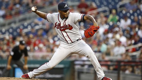 Atlanta Braves \pitcher Julio Teheran throws to a Washington Nationals batter during the third inning on Tuesday, July 30, 2019.