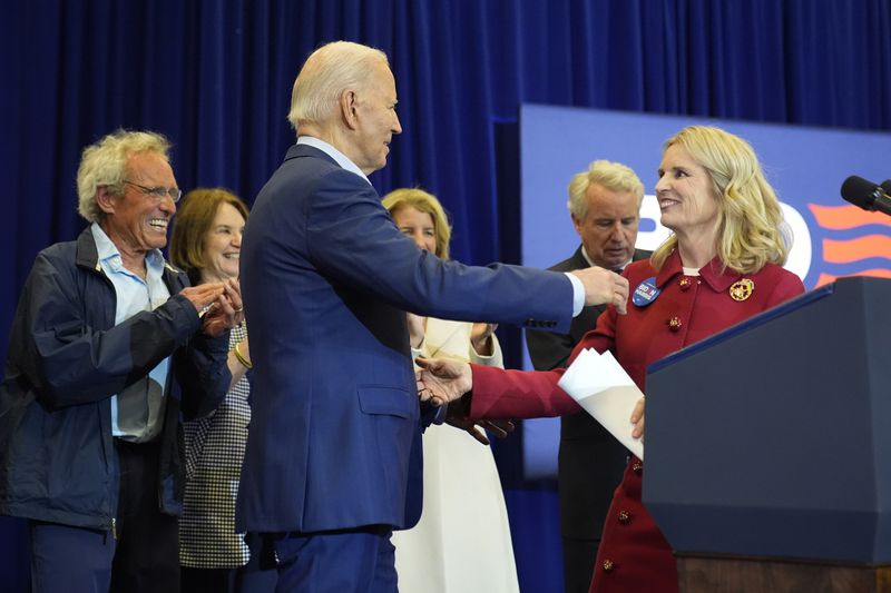 Kerry Kennedy, right, introduces President Joe Biden, third from left, at a campaign event, Thursday, April 18, 2024, in Philadelphia. Pictured from left are members of the Kennedy family Joe Kennedy III, Kathleen Kennedy Townsend, Rory Kennedy and Christopher Kennedy. (AP Photo/Alex Brandon)