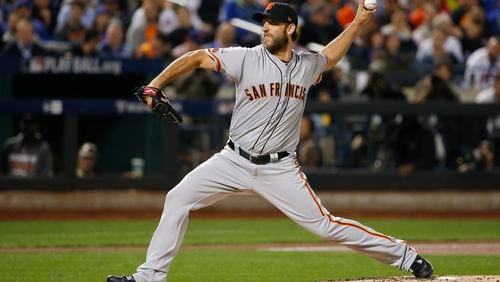 San Francisco Giants starting pitcher Madison Bumgarner (40) delivers against the New York Mets. (AP Photo/Kathy Willens)