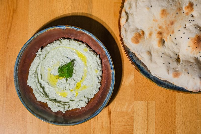 Chelo's signature dip is a thick mix of labneh and feta swirled with grated olives and jalapeno. Courtesy of Chelo