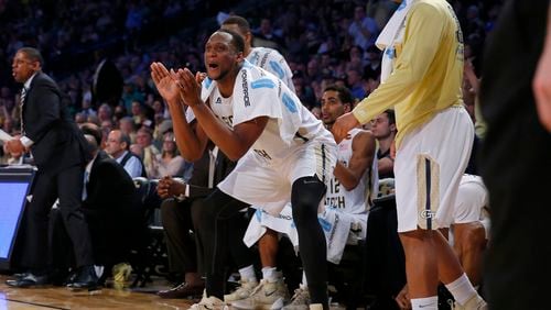Georgia Tech forward Charles Mitchell applauds on the bench during the second half of the team's NCAA college basketball game against Notre Dame in Atlanta, Saturday, Feb. 20, 2016. Georgia Tech won the game 63-62. (AP Photo/Todd Kirkland)