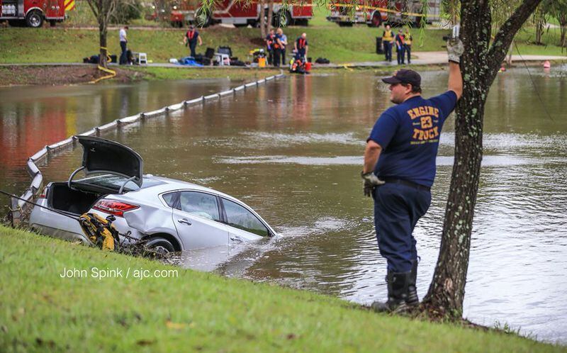 Divers discovered that no one was in the car. JOHN SPINK / JSPINK@AJC.COM