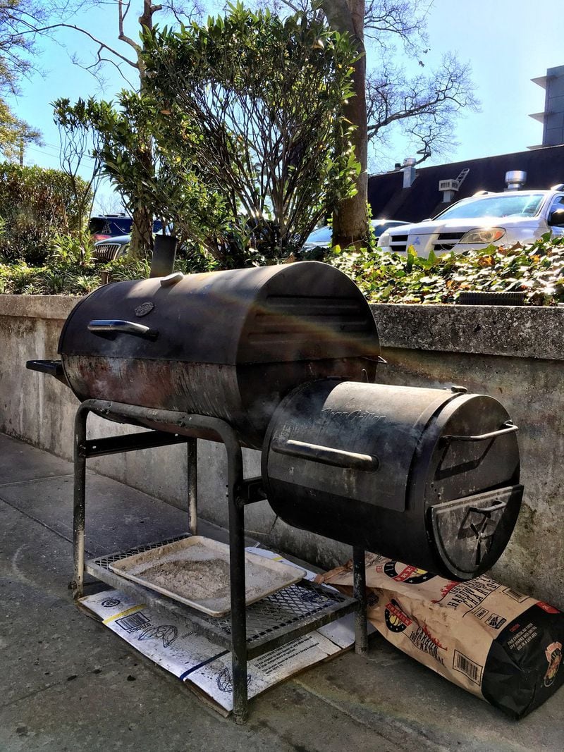 The smoker where Irie Mon Cafe makes jerk chicken is basic but produces excellent, aromatic chicken. PHOTO CREDIT: Wyatt Williams