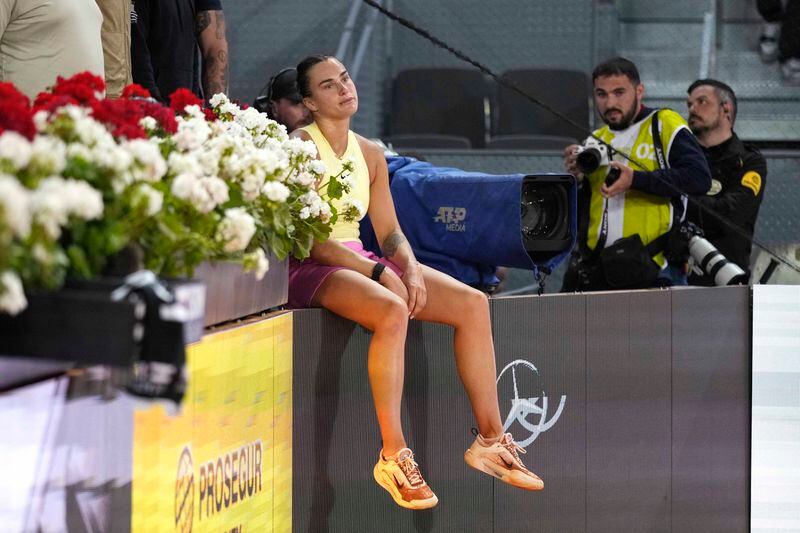 Aryna Sabalenka of Belarus reacts after loosing against Poland's Iga Swiatek in the women's final match against at the Mutua Madrid Open tennis tournament in Madrid, Spain, Saturday, May 4, 2024. (AP Photo/Bernat Armangue)