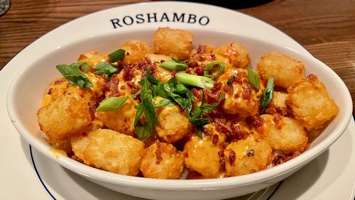 The tots at Roshambo are served disco-style, with a pimento cheese Mornay sauce. Angela Hansberger for The Atlanta Journal-Constitution