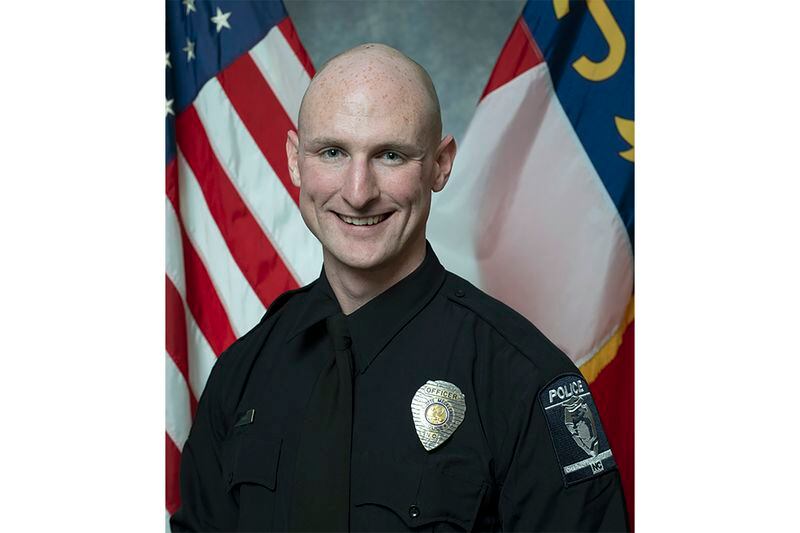 This photo provided by the Charlotte-Mecklenburg Police Department shows Charlotte-Mecklenburg police officer Joshua Eyer. A shootout on Monday, April 29, 2024, killed Eyer, and three law enforcement officers and wounded four others in North Carolina began as officers approached a home to serve a warrant for a felon wanted for possessing a firearm, police said. (Charlotte-Mecklenburg Police Department via AP)