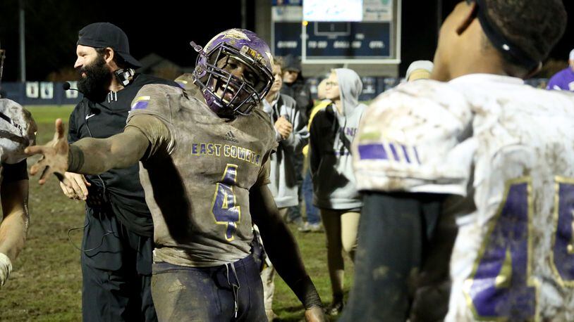 East Coweta running back Gerald Green celebrates with teammates after their 28-26 win against Marietta Friday in the first round of the Class AAAAAAA playoffs. (Jason Getz/Special)