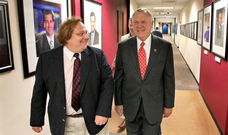 Before the governor appointed him director of his Office of Highway Safety, Harris Blackwood served as a spokesman for Nathan Deal’s gubernatorial campaign. Deal has stuck with him despite allegations of inappropriate behavior by several women in 2014. The two are shown here in 2010 at the offices of WSB-TV, following an on-air interview. JOHN SPINK / JSPINK@AJC.COM