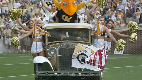 Georgia Tech's newly restored Ramblin Wreck carries Buzz and the cheerleaders on the filed during the first home game of the 2007 football season at Grant Field. The wreck had to be repaired after a crash.