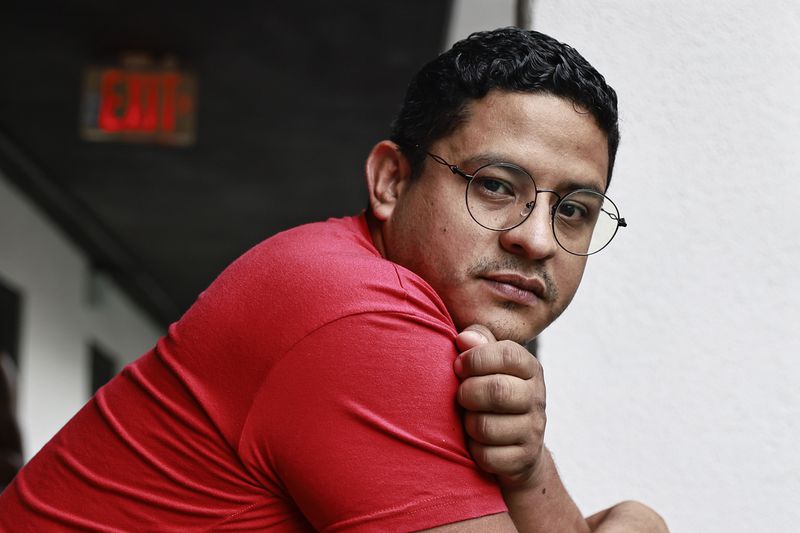 Klinsman Torres, 31, stands outside of the hotel he is living in while seeking asylum in The U.S. after fleeing Venezuela on Friday, September 9, 2022. (Natrice Miller/natrice.miller@ajc.com). 