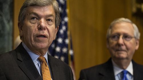 Sen. Roy Blunt, R-Mo., speaks as Senate Majority Leader Mitch McConnell, R-Ky., looks on during a news conference on Nov. 30, 2017. (Zach Gibson/The New York Times)