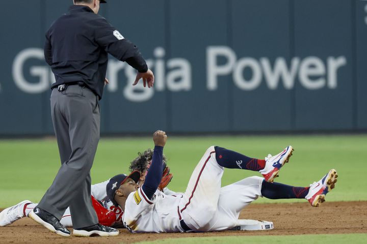 Philadelphia Phillies’ Cristian Pache (19) safely steals second base against Atlanta Braves second baseman Ozzie Albies during the fifth inning of NLDS Game 2 in Atlanta on Monday, Oct. 9, 2023.   (Miguel Martinez / Miguel.Martinezjimenez@ajc.com)