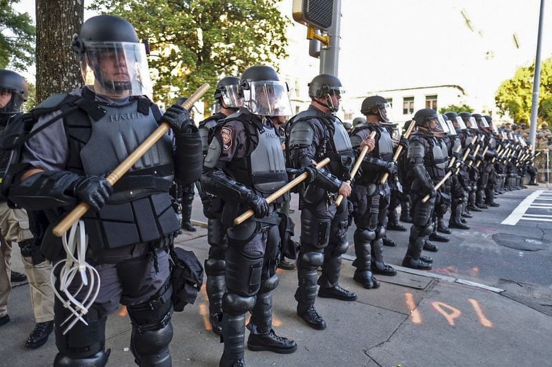 Police in riot gear control the area around the Capitol as protests continued for a third day on Sunday, May 31, 2020 (Photo: Ben Gray for The Atlanta Journal-Constitution)