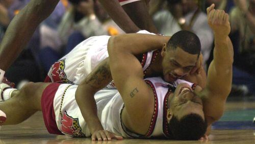 Maryland players Juan Dixon (top) and Lonny Baxter celebrate after winning the NCAA Championship game against Indiana on April 1, 2002 at the Georgia Dome.