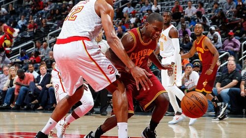 ATLANTA, GA - OCTOBER 10: Toney Douglas #15 of the Cleveland Cavaliers loses the ball as he drives against Edy Tavares #22 of the Atlanta Hawks at Philips Arena on October 10, 2016 in Atlanta, Georgia. NOTE TO USER User expressly acknowledges and agrees that, by downloading and or using this photograph, user is consenting to the terms and conditions of the Getty Images License Agreement. (Photo by Kevin C. Cox/Getty Images)