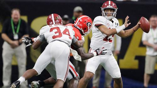 Alabama quarterback Tua Tagovailoa drops back to pass during the second half of the College Football Playoff national championship game against Georgia on Jan. 8.