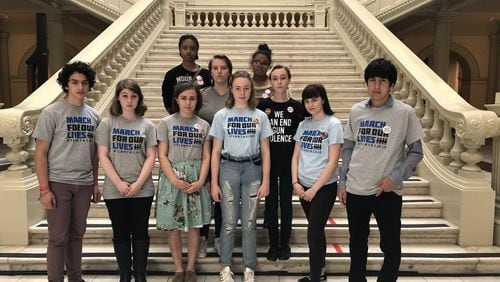 Students from Georgia high schools stand at the Georgia State Capitol after being denied access to public Senate and House galleries. ALAA ELASSAR / AJC