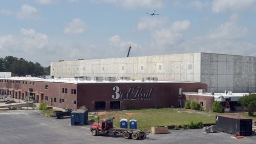 The construction site of Third Rail Studios, one of the first developments at the former General Motors site in Doraville, is shown in May. Though efforts to get DeKalb schools to join a tax allowcation district or TAD are at an impasse, taxpayers could still be responsible for funding infrastructure improvements at the old GM factory, even if the DeKalb County school board won’t sign on. The development team and Doraville officials are working on alternatives to the proposed TAD. KENT D. JOHNSON /kdjohnson@ajc.com