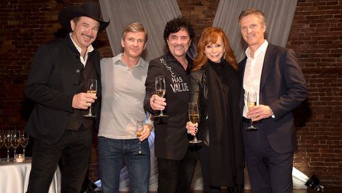NASHVILLE, TN - DECEMBER 15: Kix Brooks, Lew Dickey of Cumulus Media, Scott Borchetta of Big Machine Label Group, Reba McEntire, and John Dickey of Cumulus Media attend the Inaugural Nash Icon ACC Awards post-show party honoring Reba as the first recipient of the NASH ICON Award at aVenue on December 15, 2014 in Nashville, Tennessee. (Photo by Rick Diamond/Getty Images for Big Machine)