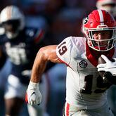 Georgia tight end Brock Bowers (19) carries the ball after a reception during the second half of an NCAA football game against Auburn, Saturday, Sept. 30, 2023, in Auburn, Ala. Bowers is a possible first round pick in the NFL Draft. (AP Photo/Butch Dill, File)