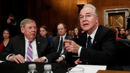 Health and Human Services Secretary nominee, Rep. Tom Price, R-Ga., accompanied by Sen. Johnny Isakson, R-Ga., who introduced him, speaks on Capitol Hill in Washington, Wednesday, Jan. 18, 2017, at his first Senate confirmation hearing . (AP Photo/Carolyn Kaster)