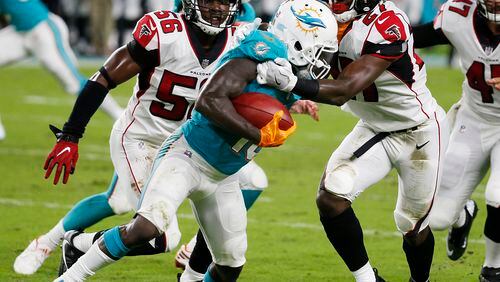 Atlanta Falcons cornerback Damontae Kazee (27) tackles Miami Dolphins wide receiver Jakeem Grant (19), during the first half of an NFL preseason football game, Thursday, Aug. 10, 2017, in Miami Gardens, Fla. (AP Photo/Wilfredo Lee)