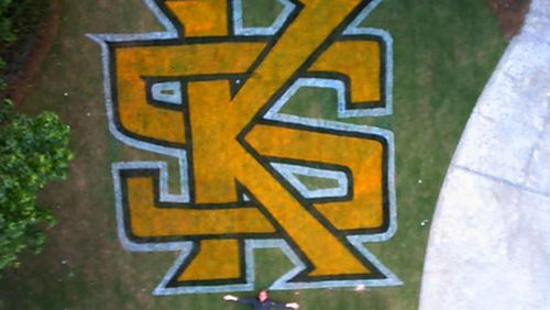 Tom Lindsey painted a Kennesaw State logo in the front lawn of their home in Powder Springs as a graduation gift for his son, Joseph (pictured). They shot this photo using a camera mounted on a drone.