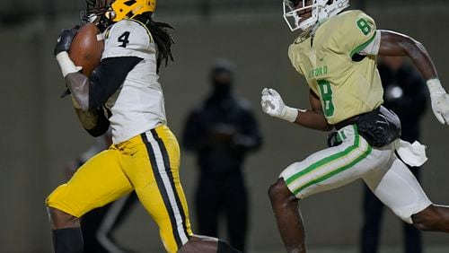 Valdosta wide receiver Aalah Brown (4) outruns Buford defensive back Ryland Gandy (8) to score a touchdown for the Wildcats late in the second half of their Class 6A semifinal game Friday, December 18, 2020 in Buford. (PHOTO/Daniel Varnado)