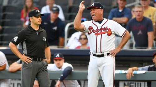 Braves manager Brian Snitker argues with umpire Mark Wegner after being ejected in the first inning. (AP Photo/John Amis)