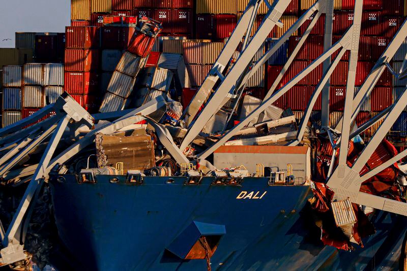 Wreckage of the Francis Scott Key Bridge rests on the container ship Dali, Saturday, March 30, 2024, in Baltimore. (AP Photo/Julia Nikhinson)