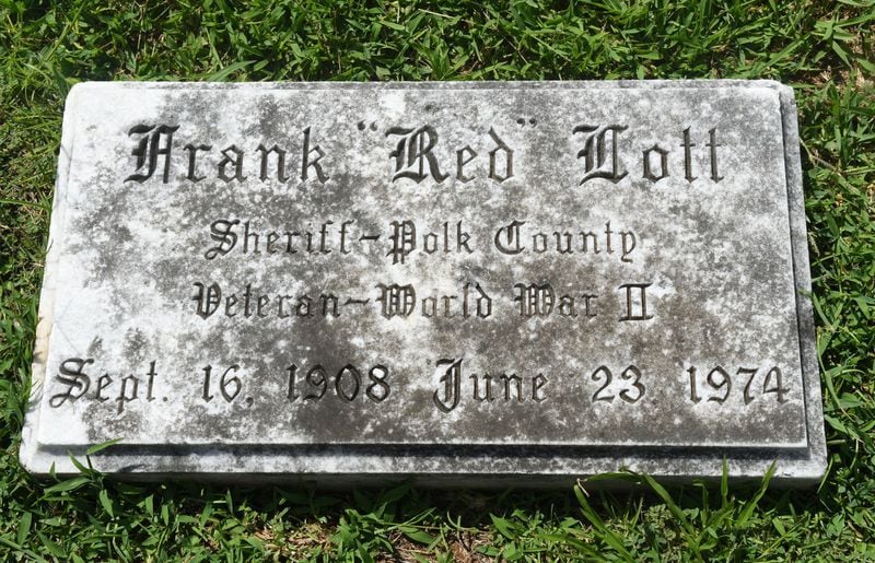 Here is Polk County Sheriff Frank Lott’s gravestone in Cedartown, Ga., on August 18, 2017. Forty-three years after Frank Lott was shot and killed as he investigated a reported burglary at the local high school, no one has been convicted. There was a suspect who went to trial but a jury acquitted him. Some say Lott’s successor damaged the case by refusing to share information with other agencies investigating the shooting. (Rebecca Breyer)