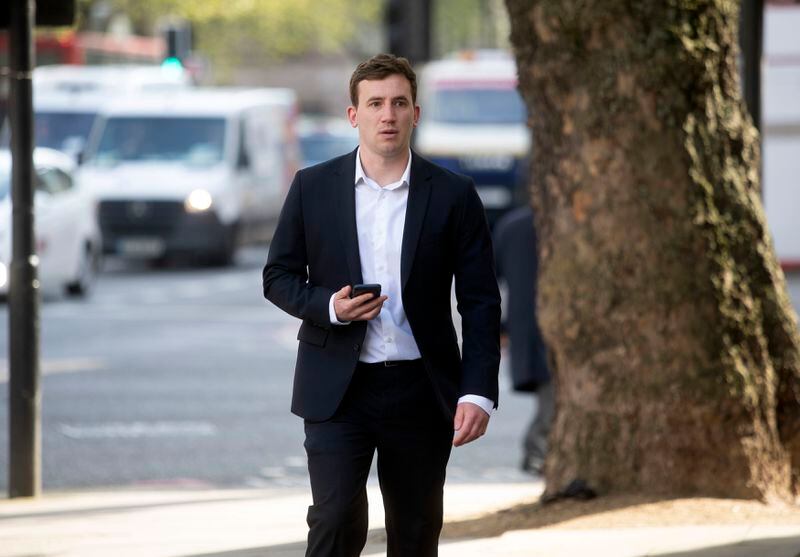 Former British parliamentary researcher Christopher Cash arrives at Westminster Magistrates' Court where he faces an Official Secrets Act charge related to allegedly gathering information for China, in London, Friday April 26, 2024. (Jeff Moore/PA via AP)