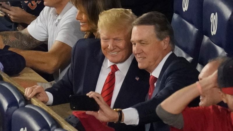 Sen. David Perdue, R-Ga., takes a selfie with President Donald Trump during the seventh inning of Game 5 of the baseball World Series between the Houston Astros and the Washington Nationals Sunday, Oct. 27, 2019, in Washington.