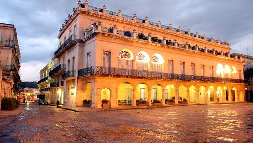 HAVANA, CUBA - SEPTEMBER 4: An exterior view of the Santa Isabel Hotel (est. 1867) and the Plaza de Armas, a main tourist square, on September 4, 2004 in old Havana, Cuba. The Plaza de Armas has been carefully restored to maintain the original 16th century Spanish colonial architecture and atmosphere. The square is the oldest in Havana, originally named "Plaza de la Iglesia" (Church Square), but received its present name when the Spanish governorship relocated to Havana in the 16th century, and the Spanish military began to use it for practices, parades, and other military events. (Photo by Sven Creutzmann/Mambo Photography/Getty Images)