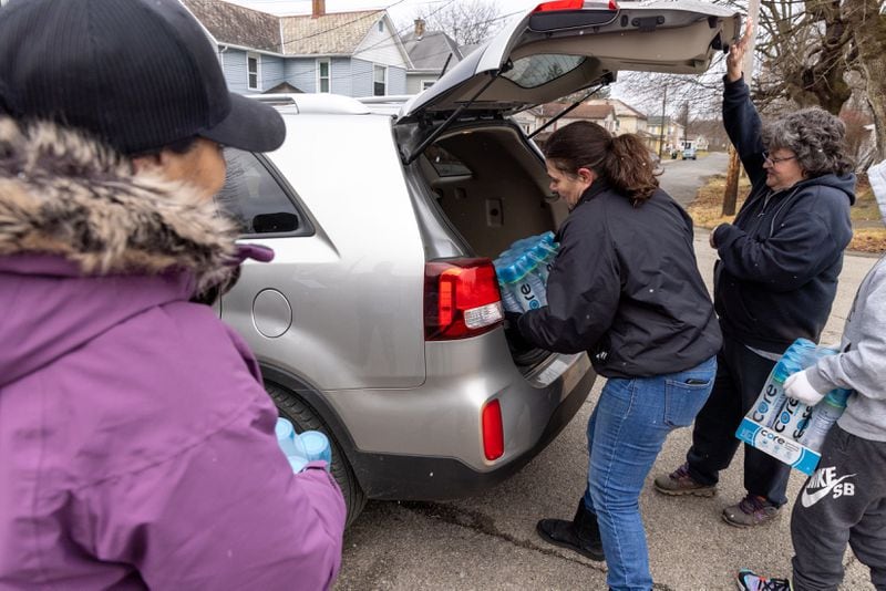 Volunteers with The Way Station hand out packages of water in East Palestine, Ohio on Friday, February 17, 2023. (Arvin Temkar / arvin.temkar@ajc.com)