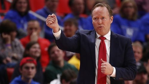 Hawks head coach Mike Budenholzer looks on from the bench while playing the Detroit Pistons at Little Caesars Arena on Nov. 10, 2017, in Detroit.