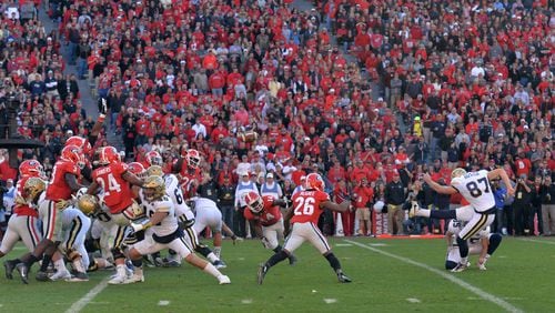 Georgia Tech placekicker Harrison Butker (87) scores an extra point to win 28-27 over the Georgia at the end of the second half at Sanford Stadium on Saturday, November 26, 2016. Georgia Tech won 28-27 over the Georgia. HYOSUB SHIN / HSHIN@AJC.COM