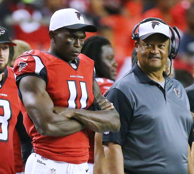 Falcons wide receiver Julio Jones watches the game from the comfort of the sidelines with wide receivers coach Terry Robiskie during the first quarter against the Ravens in their final preseason game in 2015 in Atlanta. (Curtis Compton / ccompton@ajc.com)