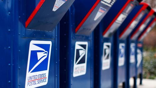 Sixteen U.S. Postal Servies workers in metro Atlanta were sentenced for delivering cocaine in exchange for bribes.