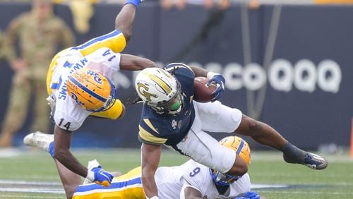 Georgia Tech running back Jahmyr Gibbs (1) is tackled by Pittsburgh defensive back Marquis Williams (14) in the first half of play during a NCAA college football game Saturday, Oct. 2, 2021 at Bobby Dodd Stadium in Atlanta. (Daniel Varnado/For the AJC)