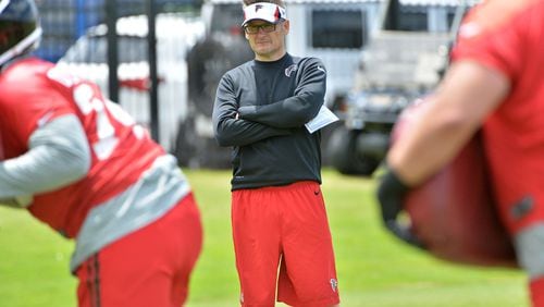Falcons general manager Thomas Dimitroff watches during the first day of 2016 Falcons rookie minicamp at the Falcons’ complex on Friday, May 6, 2016. HYOSUB SHIN / HSHIN@AJC.COM