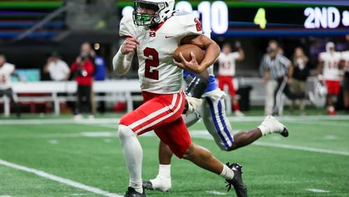 Bowdon quarterback Kyler McGrinn rushed for 221 yards and three touchdowns and passed for another touchdown in his team's 28-27 victory over Manchester in the Class A Division 2 championship game Monday at Mercedes-Benz Stadium,