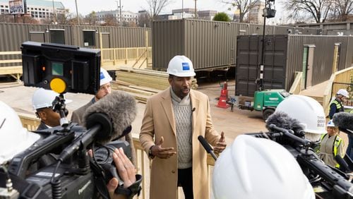 Atlanta Mayor Andre Dickens gives a press conference following a tour of 184 Forsyth Street, a development of shipping containers repurposed into housing for unhoused people, in Atlanta on Friday, December 22, 2023. (Arvin Temkar / arvin.temkar@ajc.com)