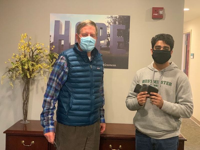 High school senior Azeez Ishaqui donates reusable face masks to the Atlanta Mission, and meets President and CEO Jim Reese. (Courtesy of Azeez Ishaqui)