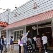 A line forms Wednesday for the reopening of Mary Mac’s Tea Room in Midtown Atlanta. The iconic restaurant’s roof collapsed after a storm in March.