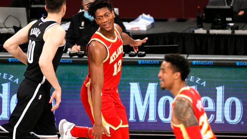 The Atlanta Hawks' De'Andre Hunter (12) reacts during the second half against the Brooklyn Nets at Barclays Center in New York on Friday, Jan. 1, 2021. The Hawks won, 114-96. (Sarah Stier/Getty Images/TNS)