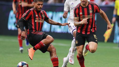 May 12, 2019 Atlanta: Atlanta United forwards Josef Martinez (left) and Hector Villalba work the ball against Orlando City during the first half in a MLS soccer match on Sunday, May 12, 2019, in Atlanta.  Curtis Compton/ccompton@ajc.com