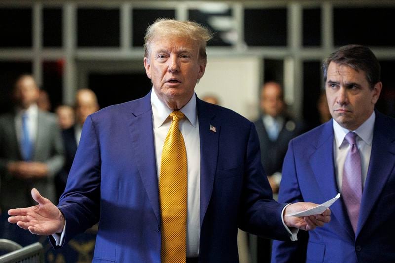 Former President Donald Trump, with his lawyer Todd Blanche, right, speaks to members of the media as he arrives at Manhattan criminal court, Tuesday, May 7, 2024, in New York. (Sarah Yenesel/Pool Photo via AP)